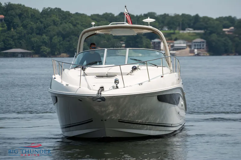  Yacht Photos Pics 2016 Sea Ray 370 Sundancer yacht cruising on a serene lake.