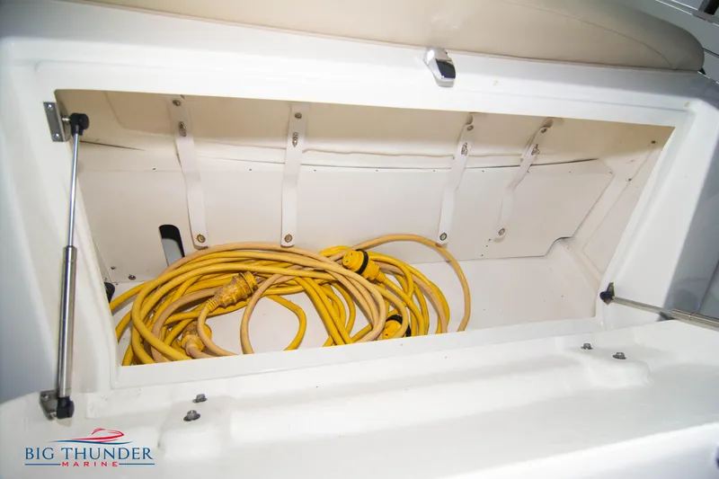  Yacht Photos Pics Storage compartment with yellow cables on a 2016 Sea Ray 370 Sundancer boat.