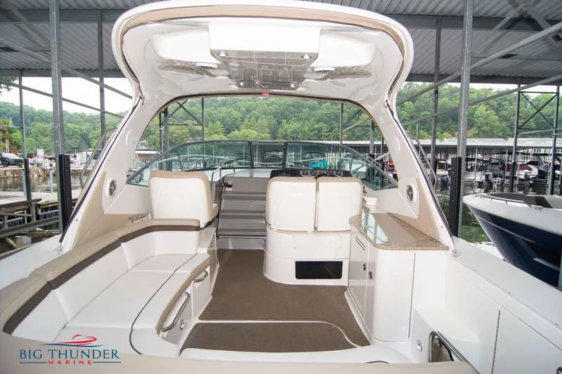  Yacht Photos Pics 2016 Sea Ray 370 Sundancer interior with seating and helm, docked at marina.