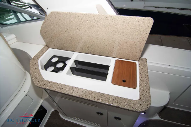  Yacht Photos Pics Interior view of 2016 Sea Ray 370 Sundancer boat's kitchenette with countertop and storage.
