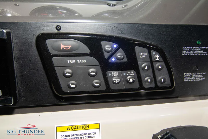  Yacht Photos Pics Control panel of a 2016 Sea Ray 370 Sundancer boat with various switches and buttons.