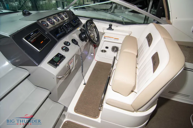  Yacht Photos Pics 2016 Sea Ray 370 Sundancer helm with beige seating and modern controls.