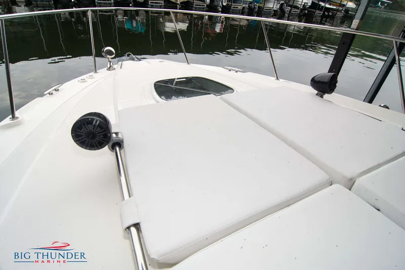  Yacht Photos Pics 2016 Sea Ray 370 Sundancer boat deck with sun pads and railing at marina.