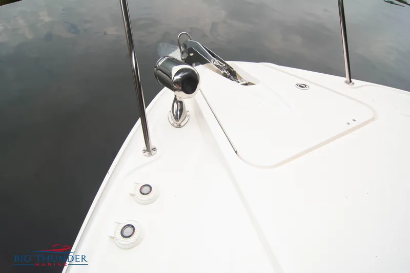  Yacht Photos Pics 2016 Sea Ray 370 Sundancer bow with anchor and railing on calm water.