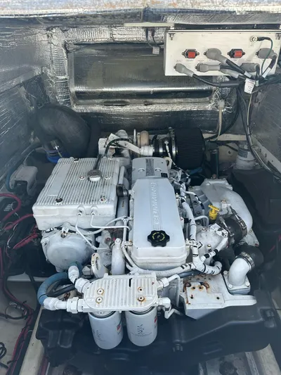  Yacht Photos Pics Engine compartment of a 2016 Strike 35 boat, showcasing detailed mechanical components.