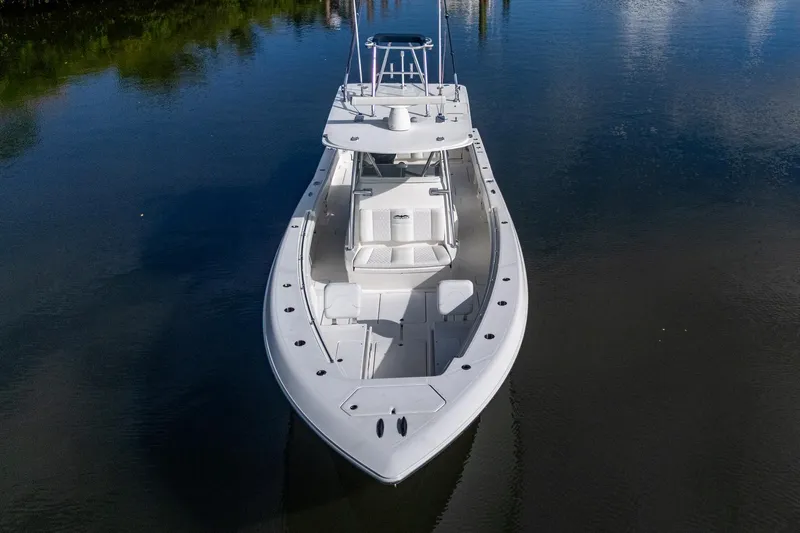  Yacht Photos Pics 2016 Invincible 39 Open Fisherman boat on calm water, aerial view.