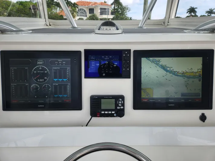  Yacht Photos Pics Dashboard of 2016 Invincible 39 Open Fisherman with navigation and control screens.