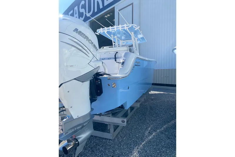  Yacht Photos Pics 2023 Invincible 33 Catamaran with Mercury engine, displayed outdoors.