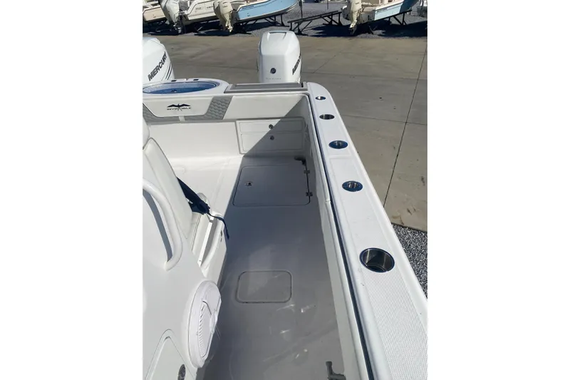  Yacht Photos Pics 2023 Invincible 33 Catamaran boat interior with rod holders and seating.