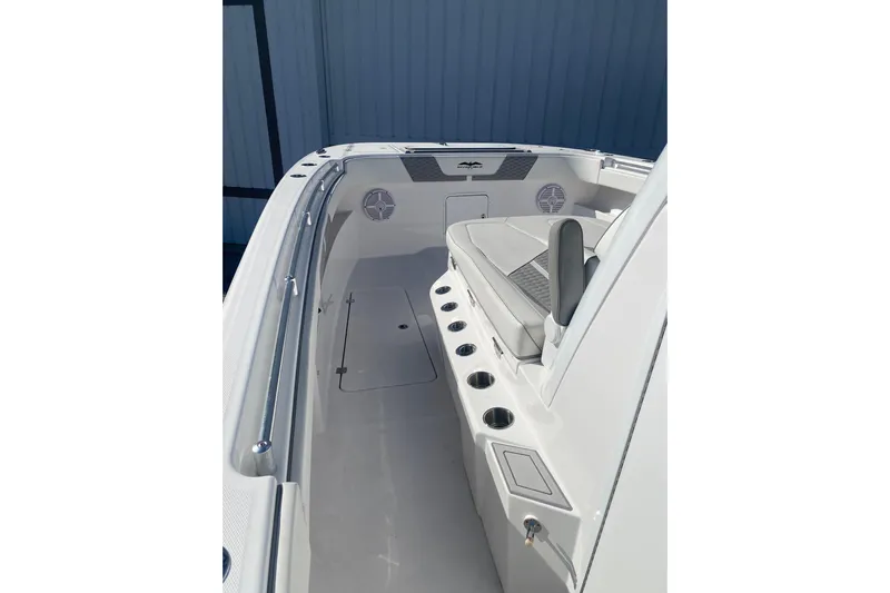  Yacht Photos Pics 2023 Invincible 33 Catamaran interior with seating and cup holders.