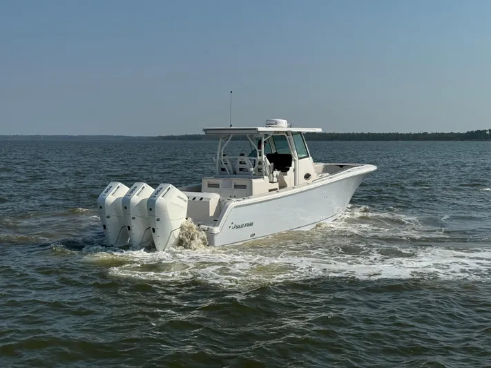 Yacht Photos Pics 2024 Sailfish 360 CC boat cruising on open water.