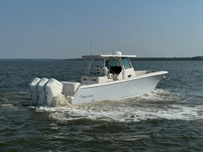  Yacht Photos Pics 2024 Sailfish 360 CC boat cruising on open water.