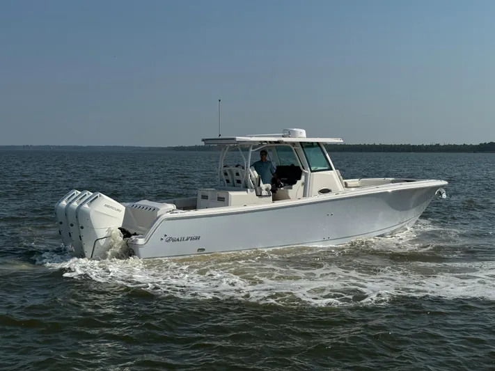  Yacht Photos Pics 2024 Sailfish 360 CC boat cruising on open water.
