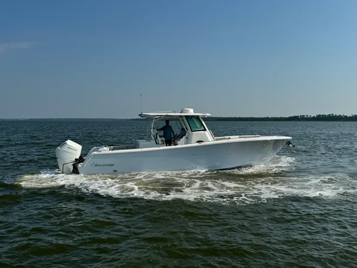  Yacht Photos Pics 2024 Sailfish 360 CC boat cruising on open water.