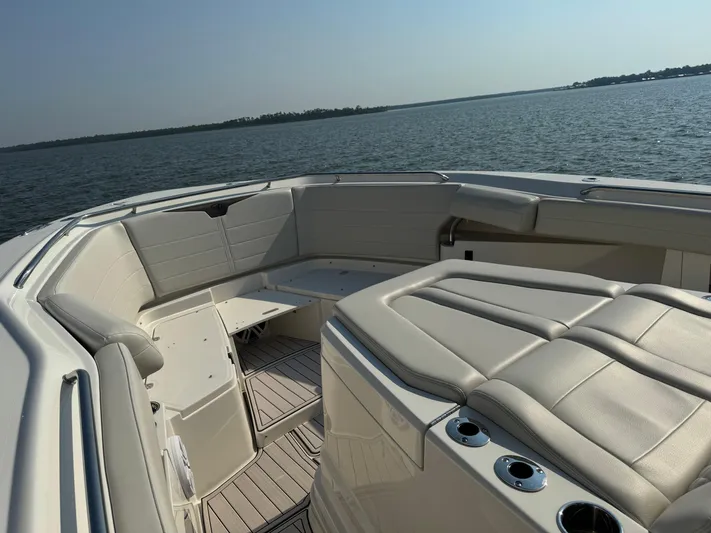  Yacht Photos Pics 2024 Sailfish 360 CC boat interior with cushioned seating, ocean view.