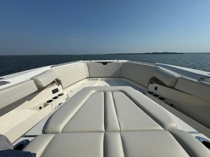  Yacht Photos Pics 2024 Sailfish 360 CC boat interior with cushioned seating on open water.