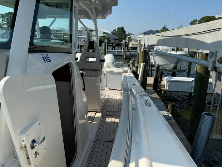  Yacht Photos Pics 2024 Sailfish 360 CC boat docked, showcasing sleek design and spacious deck.