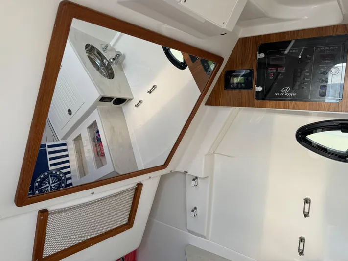  Yacht Photos Pics Interior of 2024 Sailfish 360 CC boat with mirror and control panel.
