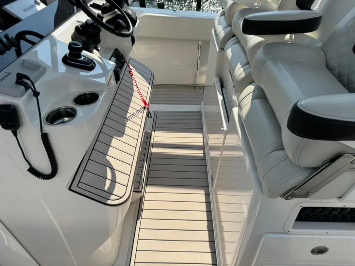  Yacht Photos Pics 2024 Sailfish 360 CC boat interior with helm and seating area.