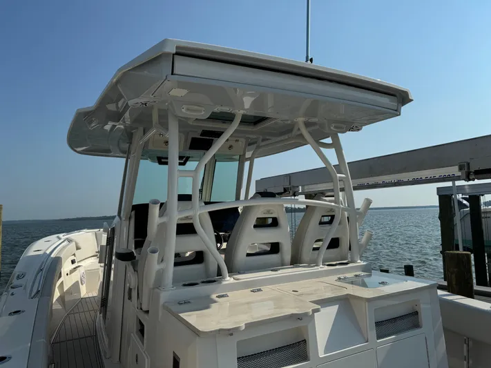  Yacht Photos Pics 2024 Sailfish 360 CC boat with sleek design, docked by the water.