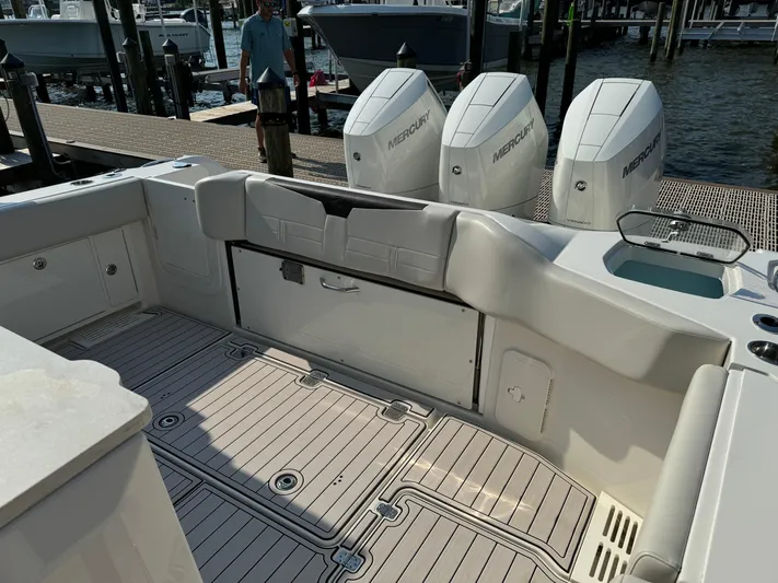 Yacht Photos Pics 2024 Sailfish 360 CC boat interior with triple Mercury engines at dock.