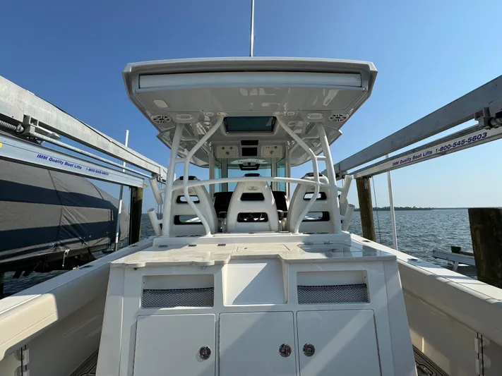  Yacht Photos Pics 2024 Sailfish 360 CC boat docked, showcasing sleek design and spacious deck.