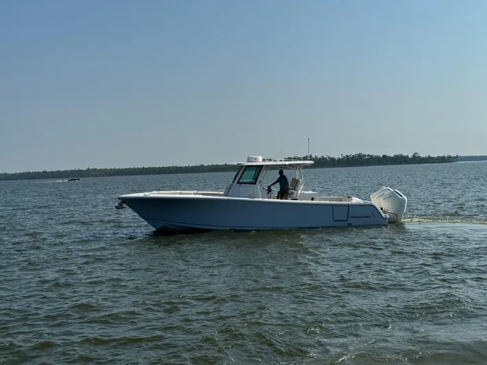 Yacht Photos Pics 2024 Sailfish 360 CC boat cruising on open water.