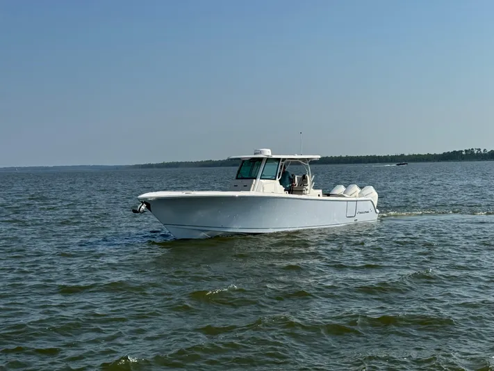  Yacht Photos Pics 2024 Sailfish 360 CC boat cruising on open water.