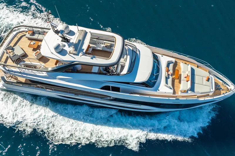  Yacht Photos Pics Luxurious 2025 Azimut Grande 26M yacht cruising on clear blue waters.