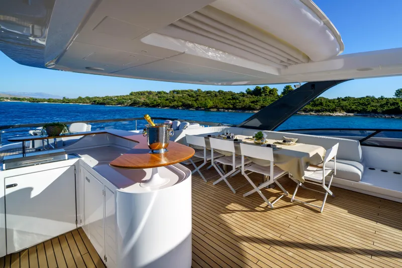  Yacht Photos Pics Luxurious Azimut Grande 26M yacht deck with dining area, ocean view, and elegant design, 2025 model.