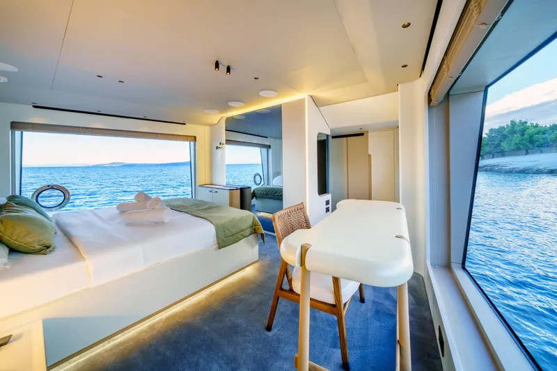  Yacht Photos Pics Luxurious bedroom interior of 2025 Azimut Grande 26M yacht with ocean view.