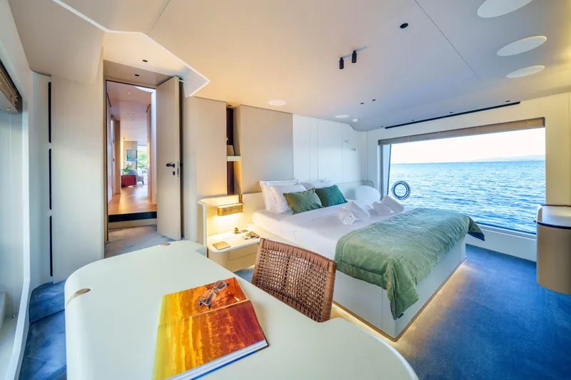  Yacht Photos Pics Luxurious bedroom on 2025 Azimut Grande 26M yacht with ocean view.