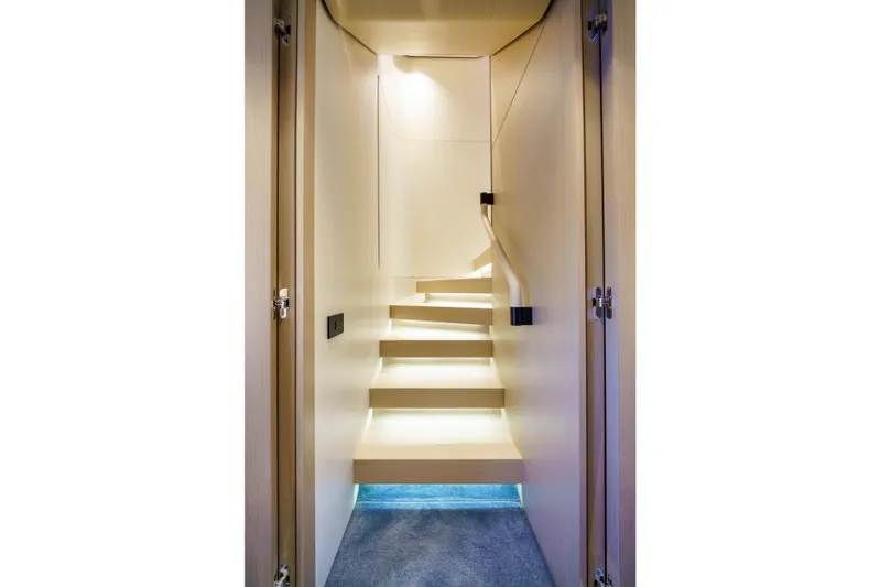  Yacht Photos Pics Staircase inside 2025 Azimut Grande 26M yacht, featuring modern design and ambient lighting.