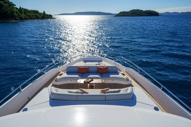  Yacht Photos Pics Luxurious Azimut Grande 26M yacht cruising on serene blue waters, 2025 model.