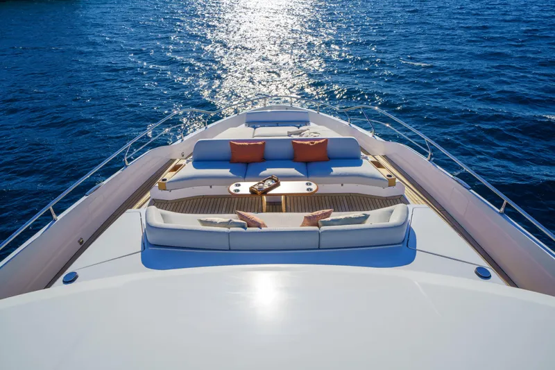  Yacht Photos Pics Luxurious Azimut Grande 26M yacht deck with elegant seating, overlooking serene ocean waters.