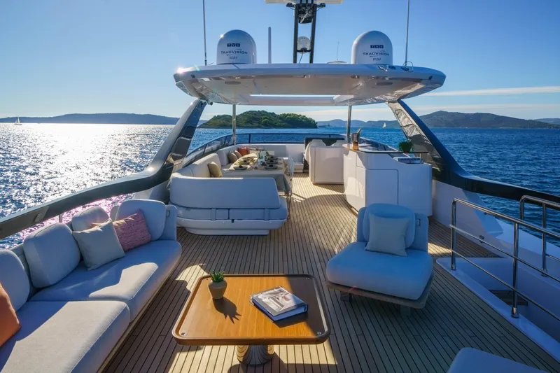  Yacht Photos Pics Luxurious 2025 Azimut Grande 26M yacht deck with elegant seating and ocean view.