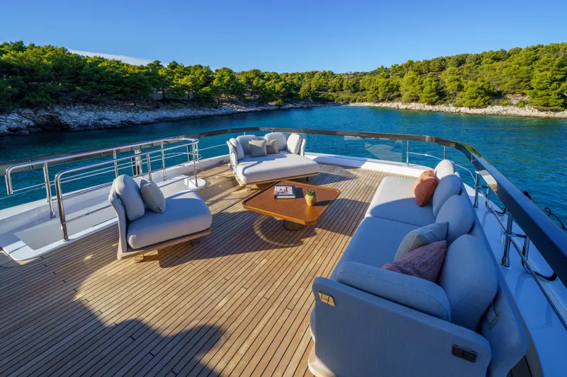  Yacht Photos Pics Luxurious deck of 2025 Azimut Grande 26M yacht with elegant seating and scenic ocean view.