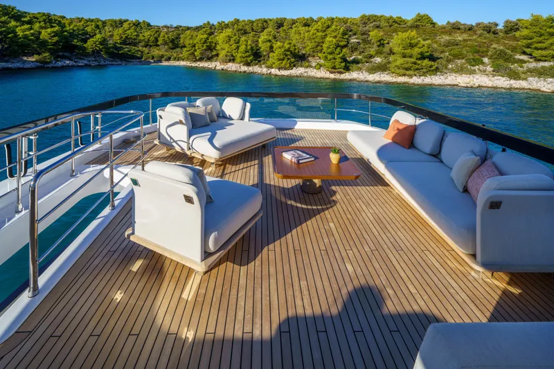  Yacht Photos Pics Luxurious deck of 2025 Azimut Grande 26M yacht with elegant seating and scenic ocean view.