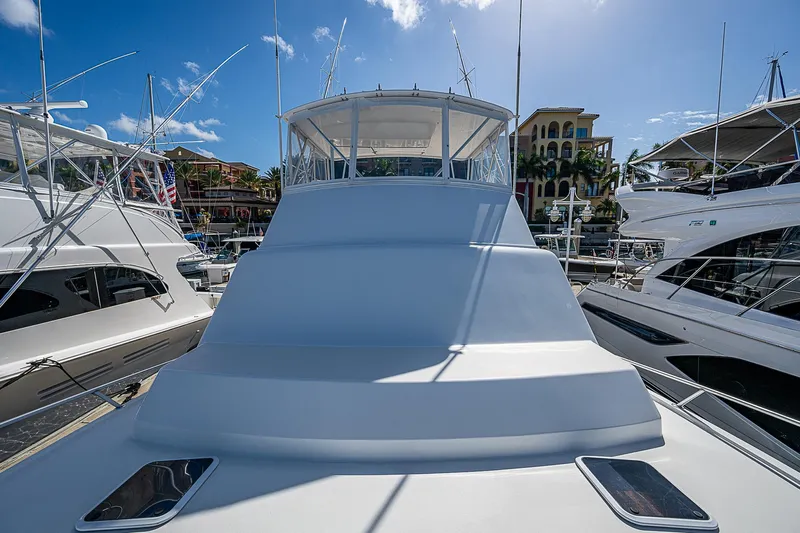 One Of Many Yacht Photos Pics 1999 Post 50 Convertible yacht docked at marina under clear blue sky.