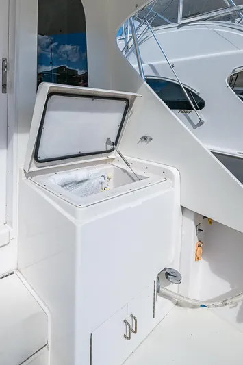 One Of Many Yacht Photos Pics 1999 Post 50 Convertible yacht with open storage compartment on deck.