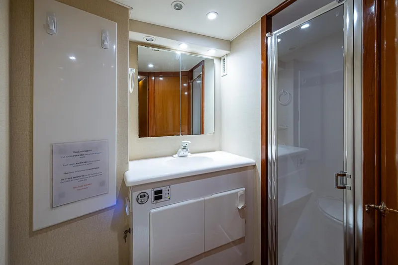 One Of Many Yacht Photos Pics Luxurious bathroom in 1999 Post 50 Convertible yacht with modern fixtures and shower.
