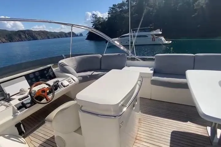  Yacht Photos Pics Luxurious 2007 Princess 21M yacht interior with elegant seating and scenic ocean view.