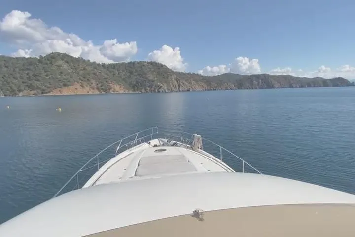  Yacht Photos Pics Bow view of 2007 Princess 21M yacht cruising on a serene lake with mountainous backdrop.