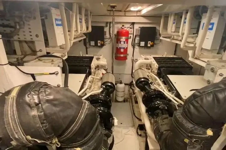  Yacht Photos Pics Engine room of a 2007 Princess 21M yacht with dual engines and fire extinguisher.