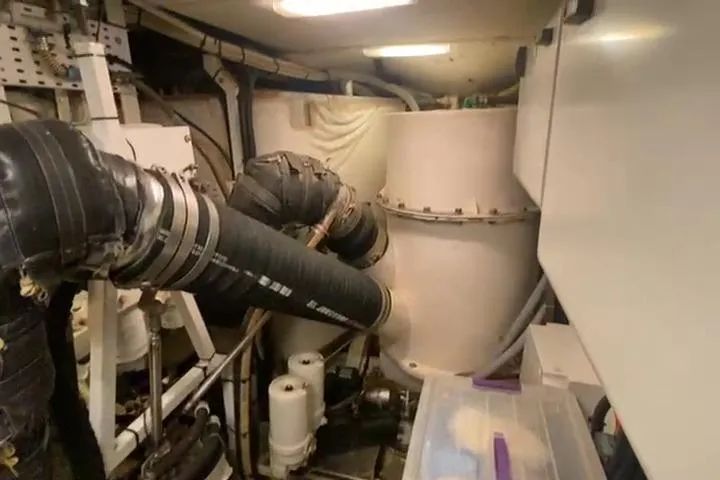  Yacht Photos Pics Engine room of a 2007 Princess 21M yacht with visible pipes and machinery.