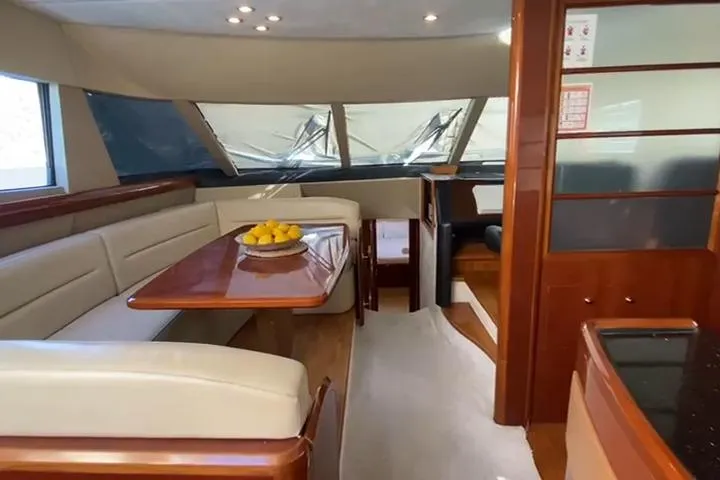  Yacht Photos Pics Luxurious interior of a 2007 Princess 21M yacht with elegant seating and dining area.