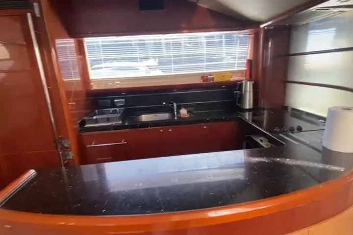  Yacht Photos Pics Luxurious kitchen interior of a 2007 Princess 21M yacht with modern amenities.