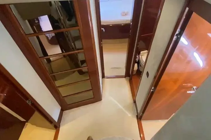  Yacht Photos Pics Luxurious interior hallway of a 2007 Princess 21M yacht with wooden finishes.