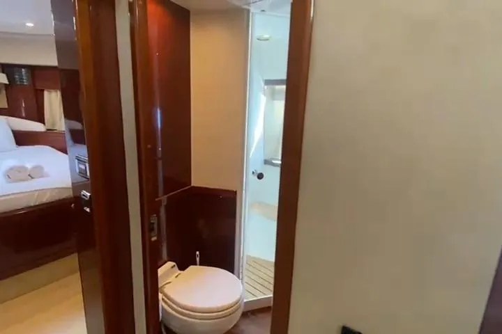  Yacht Photos Pics Interior of 2007 Princess 21M yacht showing bathroom and bedroom.