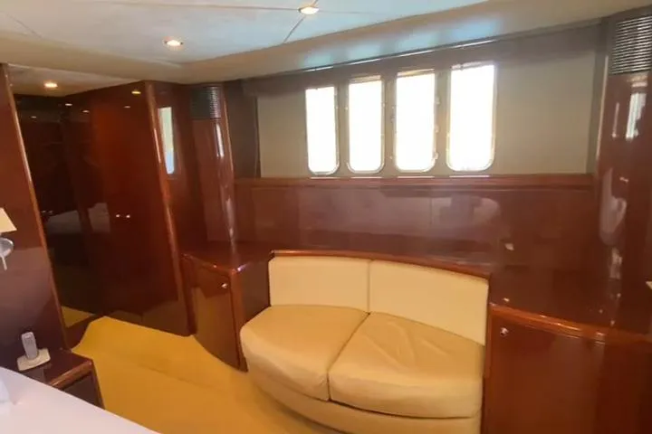  Yacht Photos Pics Luxurious interior of 2007 Princess 21M yacht with elegant wood paneling and plush seating.